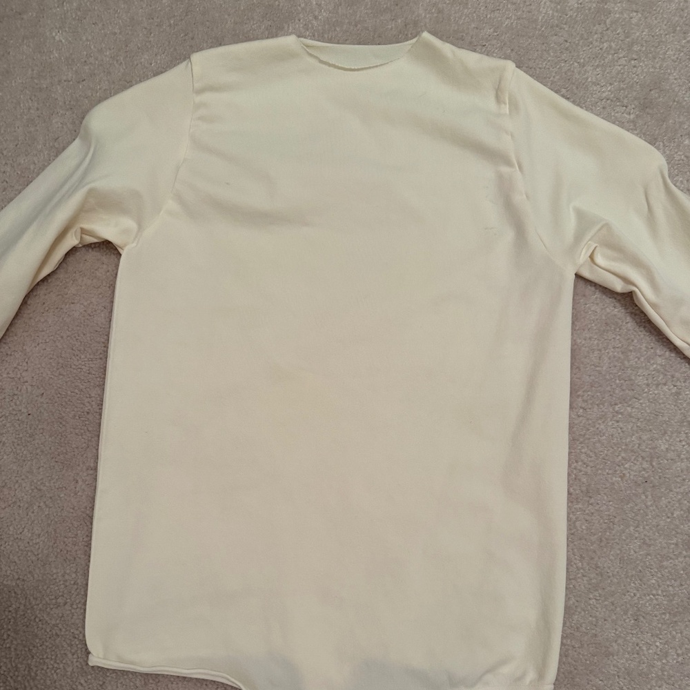 SKIMS raw hem long sleeve bodysuit in cream
